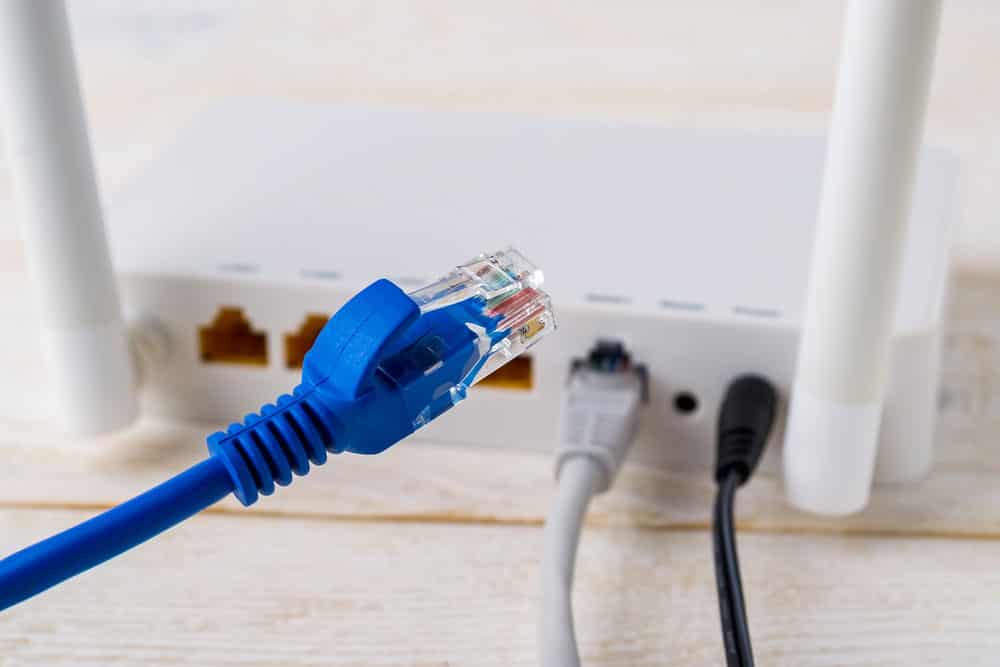 Blue ethernet cable and a router